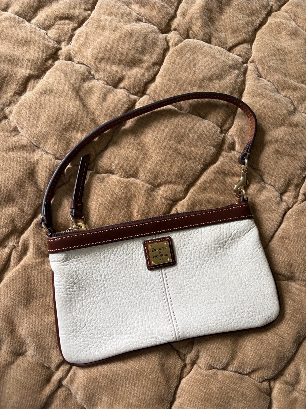 Dooney & Bourke White and Brown Leather Wristlet with Gold Plaque